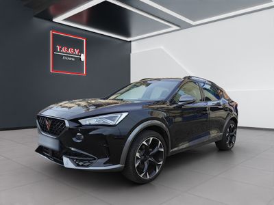 a black suv parked in a showroom with a red sign above it