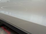 a close up of a car ' s front bumper and fender