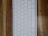 a picture of a computer keyboard on a wooden table