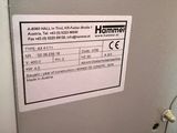 a label on the door of a refrigerator that says hammer