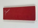 a red book with a white writing on it
