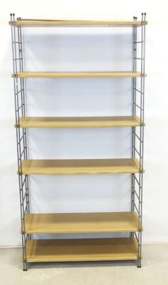 a wooden and metal shelf with four shelves on each side