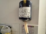 a paper towel dispenser on the wall in the kitchen