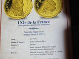 a certificate for a pair of coins on a table