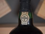 a bottle of wine that is sitting on a table