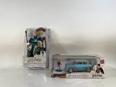 Figurines de Harry Potter et Hermione dans une boîte