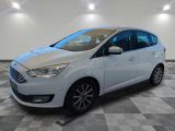 a white ford c - max parked on a checkered floor