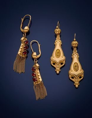 three pairs of gold earrings with garnets and garnets on them