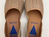 a pair of women ' s shoes on a white surface