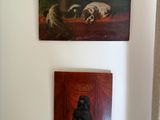two paintings on the wall above a toilet in the bathroom