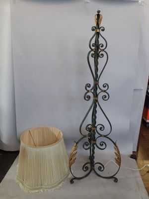 a lamp that is sitting on a table next to a lamp shade