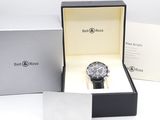 the watch is in a box with the box open on the table