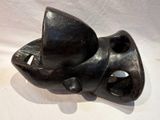 a black sculpture of a cat with a hat on it ' s head