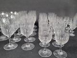 a lot of wine glasses sitting on a table