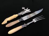three different types of knives and a knife holder on a black surface
