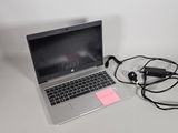 a laptop computer that is connected to a charger