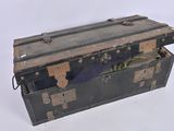 an old trunk that is open on a white surface