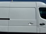 the white van is parked in the parking lot with its door open