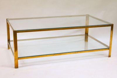 brass and glass coffee table with a glass top