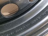 close up of a tire rim with a hole in the center of it