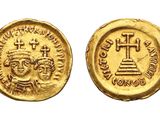 a gold coin with a cross and a cross on it