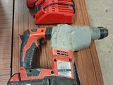 two electric tools that are sitting on a table
