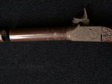 a close up of a gun on a black surface