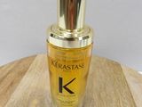 the bottle of kerastasee is sitting on a wooden table