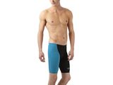 man in blue and black swim trunks standing in front of a white background
