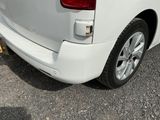 a white van that is parked in a parking lot