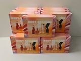 four boxes of best sellers perfume sitting on top of a white table