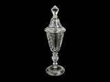 an image of a clear glass vase with a lid on a black background