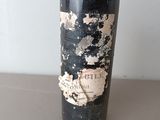 a bottle of wine that is sitting on a table