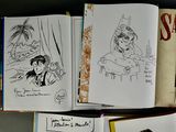 a lot of books that are sitting on a table