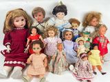 a lot of dolls that are sitting together on a table