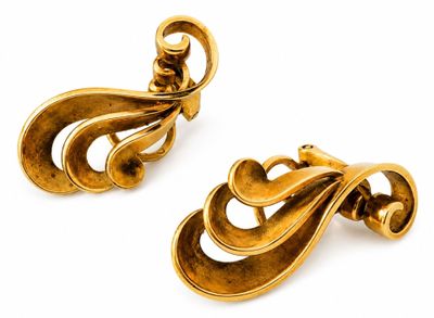 pair of gold tone clip earrings with swirl design