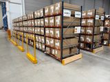 many boxes on the shelves in the warehouse
