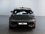 the rear view of a grey car in a showroom