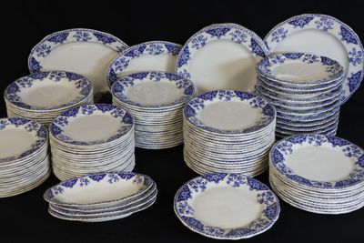 many plates with blue and white designs on them