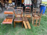 a lot of chairs that are sitting in the grass