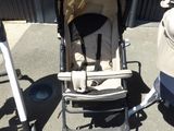 a baby stroller and a baby stroller on the ground