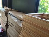 a pile of wood sitting on the floor in a room