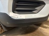 the front bumper of a car with a sticker on it ' s bumper