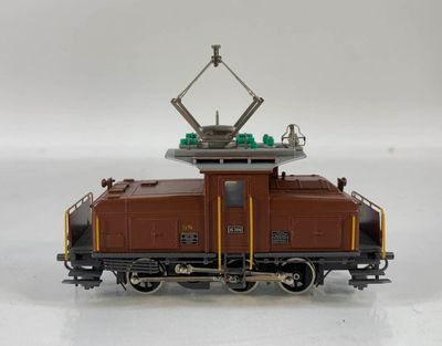 a toy train that is sitting on a white surface