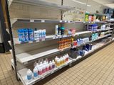 many shelves in the store that have various cleaning products on them