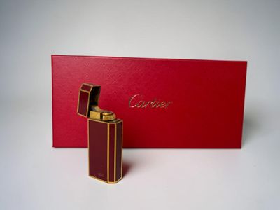 a close up of a red box with a lighter in it