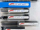 many different types of pens in a plastic container