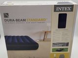 the box of the inflatable mattress is open and ready to be used