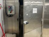 an image of a large stainless steel door in a building