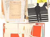 many papers and papers on a table with scissors